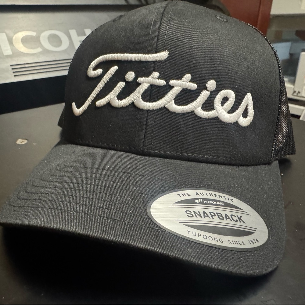 Titties Black Golf Trucker Snapback Hat with White Logo - curved bill mesh back
